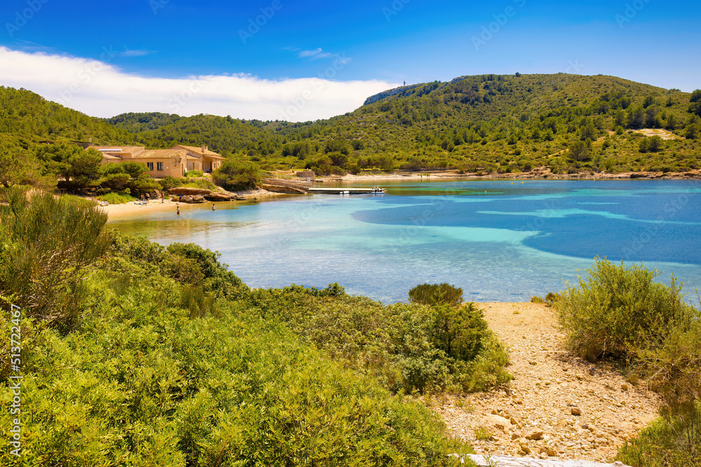 View of the cove of Sa Plageta and the house of the Felius, last owners of the island of Cabrera before its expropriation by the state. Balearic Islands, Spain View of the cove of Sa Plageta and the house of the Felius, last owners of the island of Cabrera before its expropriation by the state. Balearic Islands, Spain
