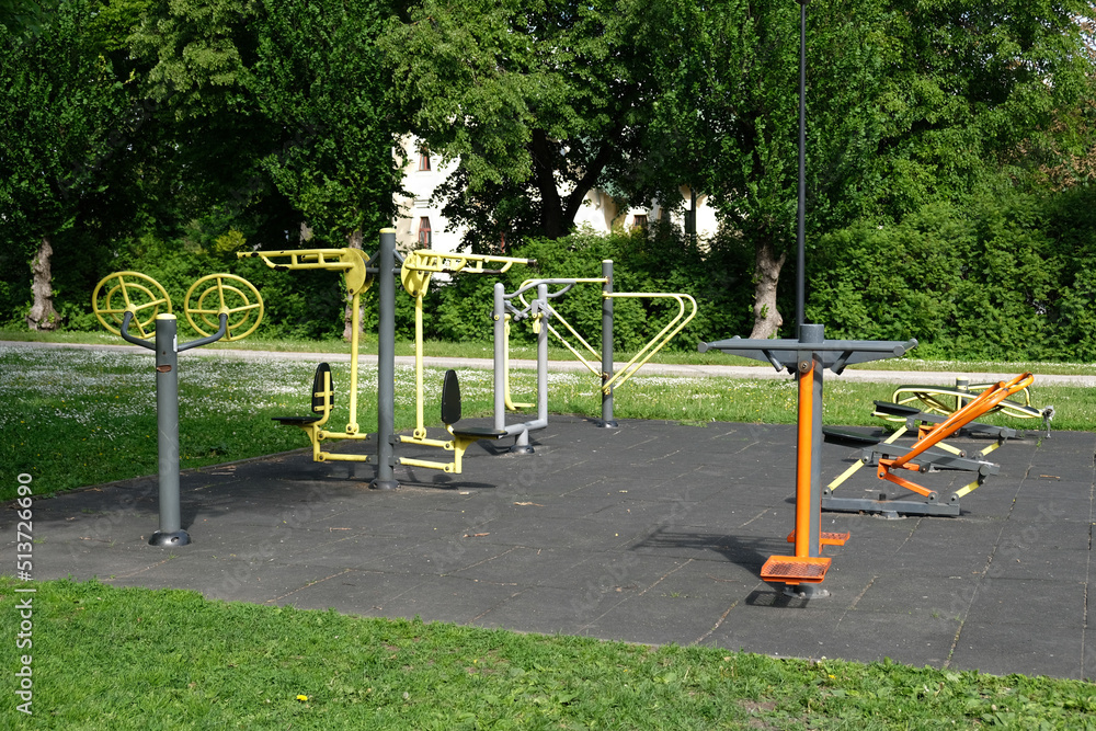 Urban sports ground with weight training and exercise equipment for sports. Sports and recreation area. Empty sports ground outdoor workout in a park. Urban sports ground with weight training and exercise equipment for sports. Sports and recreation area. Empty sports ground outdoor workout in a park.