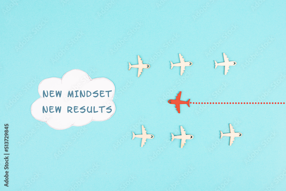 Red airplane is flying to the cloud with the words new mindset new results, changing lifestyle, coaching and improvement concept, positive thinking