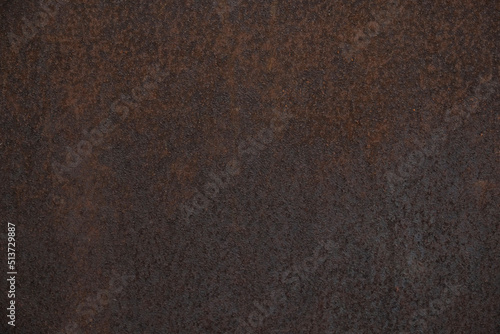 Metal corroded texture, selective focus. Dark worn rusty metal textured background. Vintage effect. Rusty iron surface background with scratches and cracks.