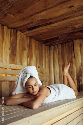 Attractive woman having rest in sauna