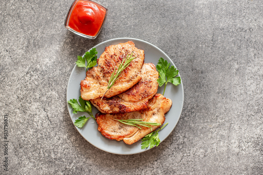 grilled pork steaks with spices on stone background grilled pork steaks with spices on stone background