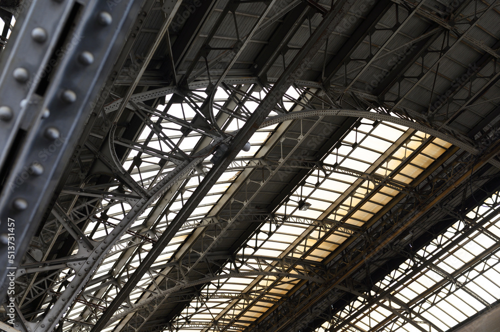 Metal arched frame construction of the old railway station in Europe