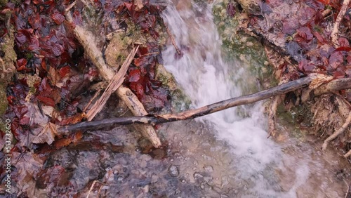 Wonderful fresh water rapids waterfalls river flowing through forest in early sprting photo