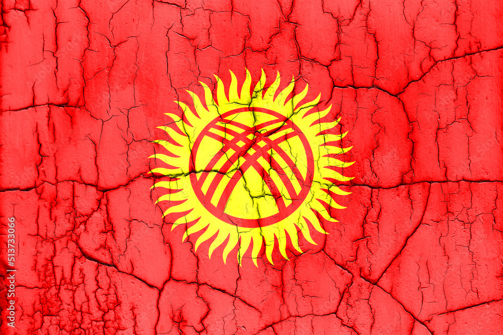 Textured photo of the flag of Kyrgyzstan with cracks.