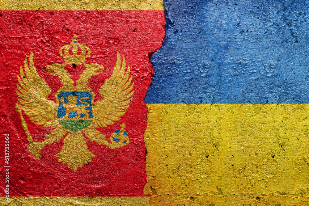 Montenegro and Ukraine - Cracked concrete wall painted with a Montenegrin flag on the left and a Ukrainian flag on the right stock photo