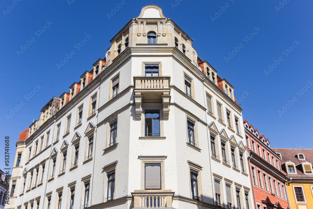 White apartment building on the corner in Dresden, Germany