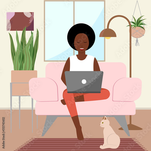 A happy adult black african woman is sitting in a chair in a home interior with a laptop and cat. Flat vector illustration