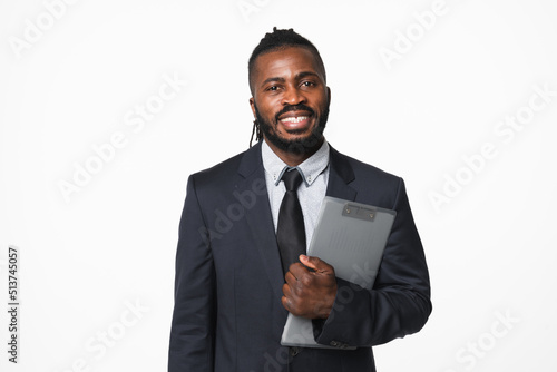 Young confident african-american businessman ceo boss leader manager in formal suit holding clipboard, inspector checking isolated in white background