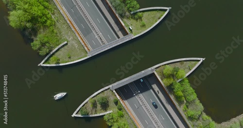 Top down view of Aquaduct Veluwemeer water bridge with Boats crossing above highway traffic.
 photo