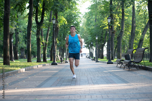 athletic sportsman runner running in sportswear outdoor