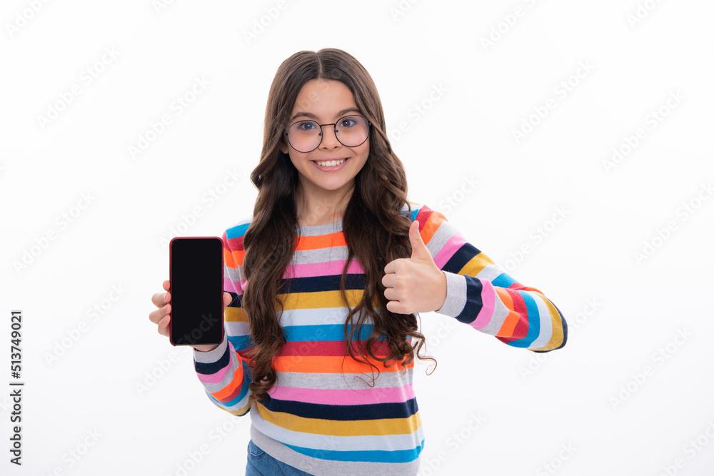 Teenage girl with smart phone. Portrait of teen child using mobile phone, cell web app. Kid showing blank screen mobile phone, mock up copy space. Teenage girl with smart phone. Portrait of teen child using mobile phone, cell web app. Kid showing blank screen mobile phone, mock up copy space.