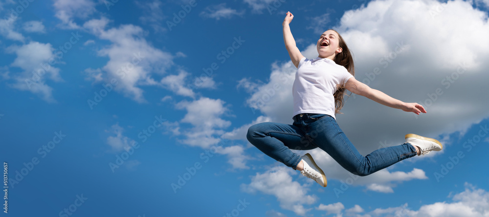 happy teen child jump on sky background. Horizontal poster of isolated child face, banner header, copy space. happy teen child jump on sky background. Horizontal poster of isolated child face, banner header, copy space.