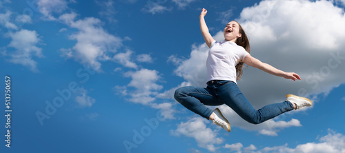 happy teen child jump on sky background. Horizontal poster of isolated child face, banner header, copy space.