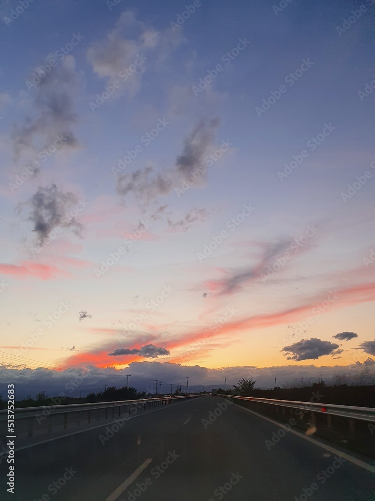 driving on the highway at sunset