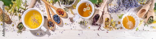 Panel kuchenny z motywem Healthy drinks, harvest herbs and flowers concept. Fresh and dried organic herbal, set of different floral tea variations, with brewed hot tea cups on white wood table copy space