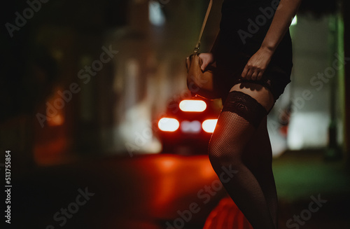 Foto Prostitute waiting for the client at night street.