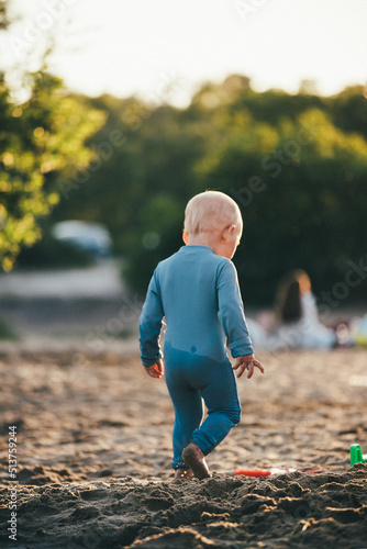 little child playing on the beach