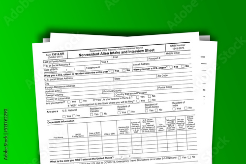 Form 13614-NR documentation published IRS USA 09.30.2021. American tax document on colored photo