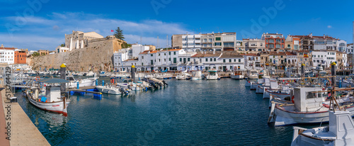 View of boats in marina overlooked by whitewashed houses, Ciutadella, Menorca, Balearic Islands