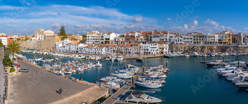 View of boats in marina and whitewashed houses from elevated position, Ciutadella, Menorca, Balearic Islands photo