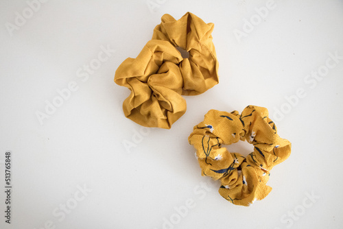 flat lay two yellow hair scrunchies