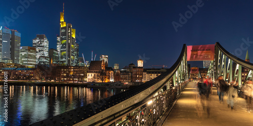 View from Eiserner Steg Bridge across Main River to the skyline of Frankfurt am Main, Hesse, Germany photo