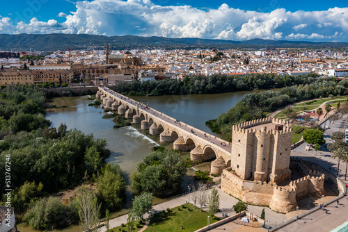 Aerial of the Historic Roman Bridge over the Guadalquivir River and Calahorra Tower, UNESCO World Heritage Site, Cordoba, Andalusia photo