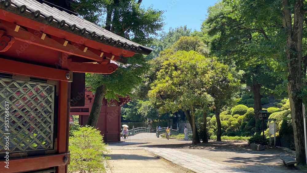The stone path with beautiful Japanese architectural corridor wall, “Nezu” shrine in downtown Tokyo, year 2022 June 28th