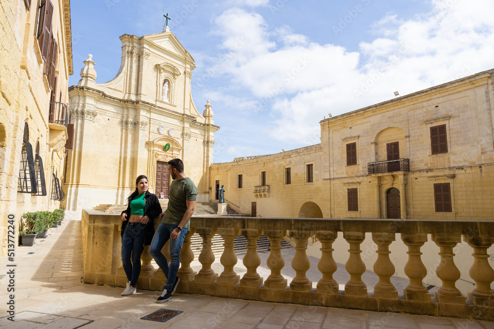 Young tourist couple visiting the Citadel in Gozo in Malta.