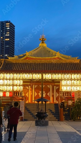 Beautiful scenery of night temple at Tokyo downtown  Ueno    Bentendo    temple on the island of a pond  vivid beautiful sky contrast and the golden paper lantern lights.  Year 2022 June 25th