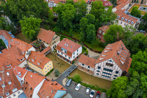 Aerial view of the historic center of Erfurt old city from above with old houses , bridge and churches