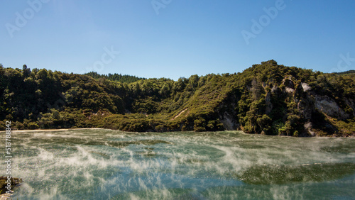Frying Pan Lake or Waimangu Cauldron - the World's Larges Hot Spring, New Zealand. Green Tropical Hills Above Hot Thermal Lake. Steam Rising Above the Hot Water Surface.