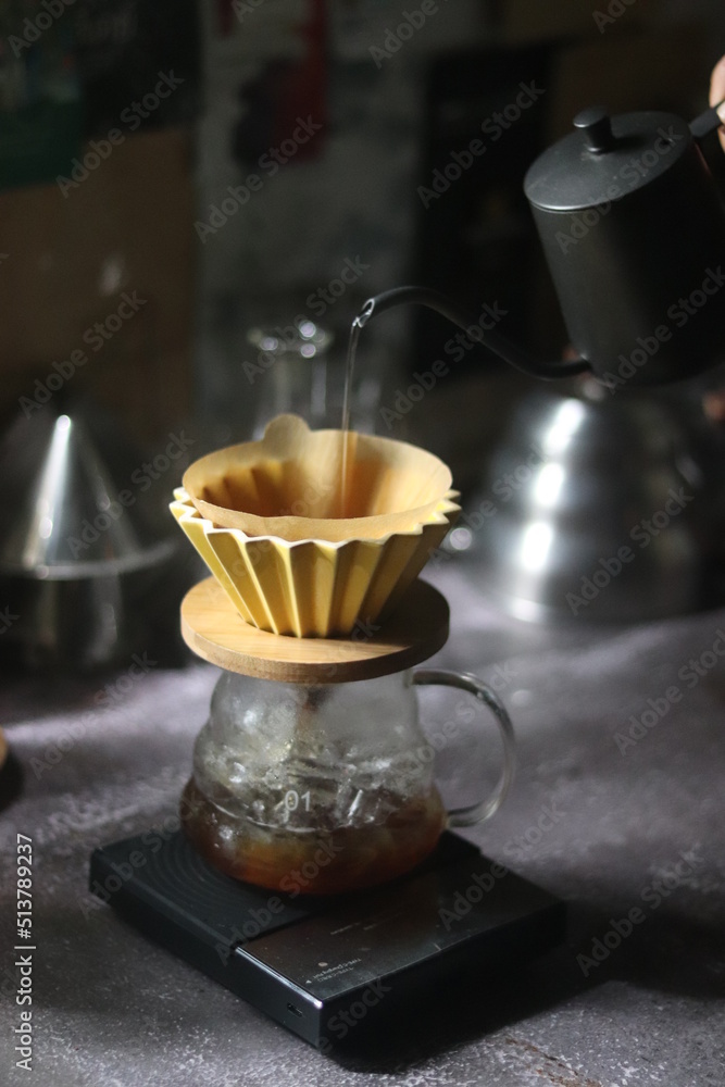 Barista brewing coffee, method pour over, drip coffee Barista brewing coffee, method pour over, drip coffee