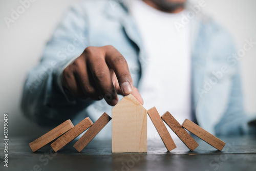 Fototapeta Naklejka Na Ścianę i Meble -  A business man plans a cost management plan to buy a small wooden house from the most complete model. It's a family success, home business real estate planning ideas. , home of happiness
