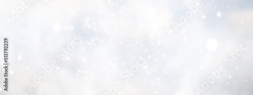 blue snowfall bokeh background, abstract snowflake background on blurred abstract blue © alexkich