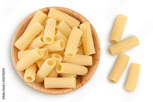 raw italian tortiglioni pasta in wooden bowl isolated on white background with full depth of field. Top view. Flat lay