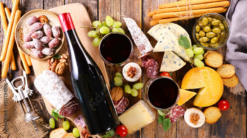 bottle of red wine and cheese platter