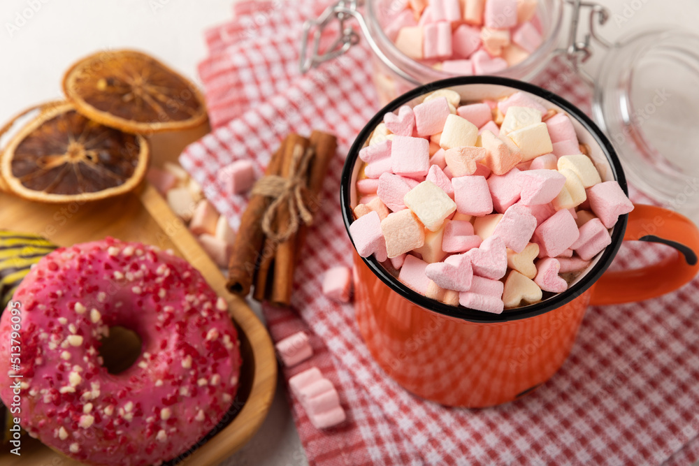 Cocoa drink on texture background. Hot chocolate with small marshmallows and spices. Winter warming drink concept. Space for copy. Space for text Cocoa drink on texture background. Hot chocolate with small marshmallows and spices. Winter warming drink concept. Space for copy. Space for text