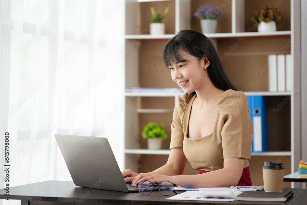 Happy smiling business woman using laptop for working and study at home or office space. Happy smiling business woman using laptop for working and study at home or office space.