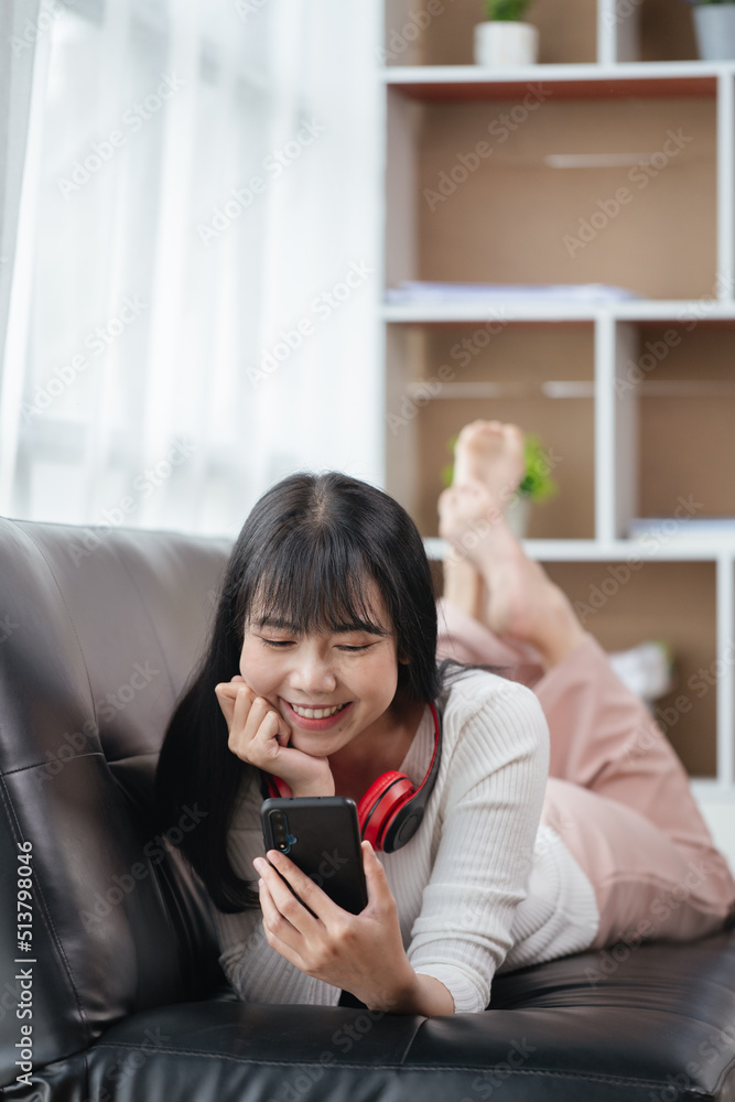 Happy woman is shopping online via smartphone at home. Happy woman is shopping online via smartphone at home.