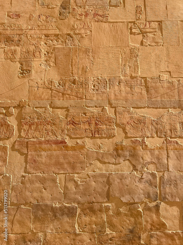 A small stone with hand carved Ancient Egyptian hieroglyphics. This stone is part of a Museum collection of Ancient Egyptian antiquities.