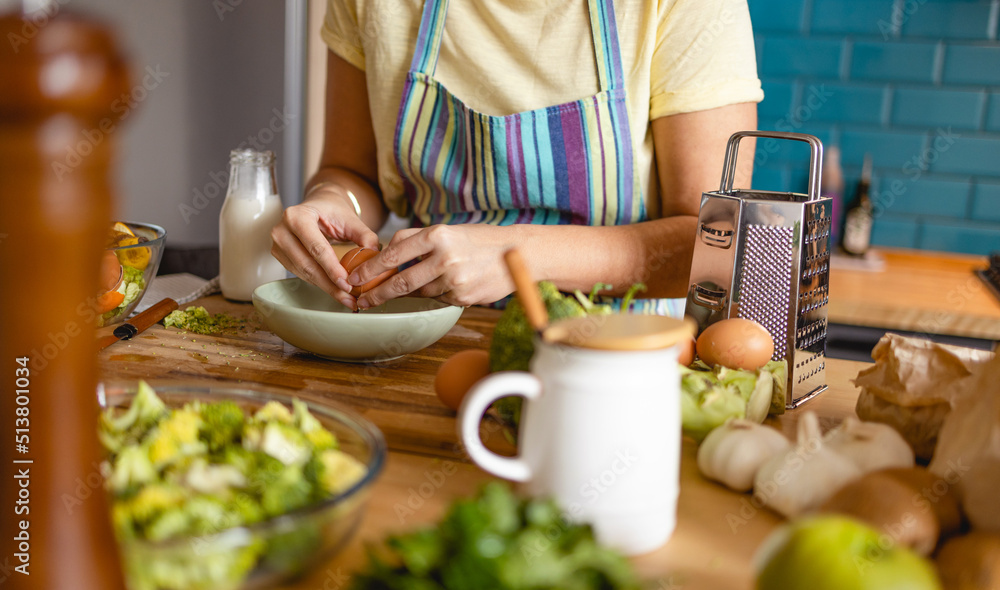 Young woman preparing lunch for her family