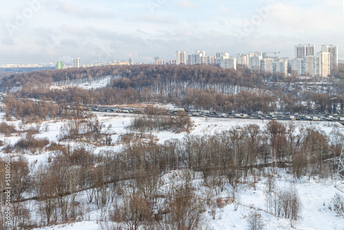 Air view winter landscape with snow trees. Winter cloudy sky overcast.