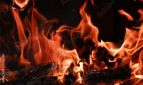 Fire flames from a wood stove fire isolated on a black background