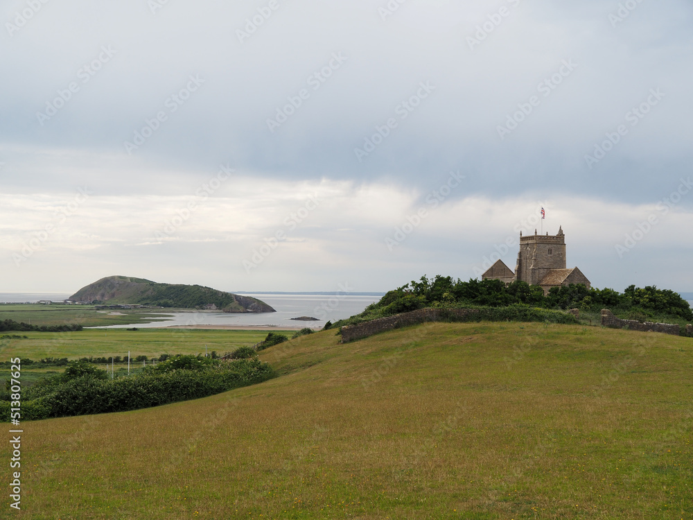 St Nicholas church i Uphill, with Brean Down in Somerset.