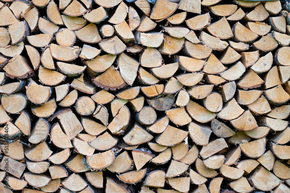 Woodpile. Wall of chopped wood, background of dry chopped wood stacked in pile Woodpile. Wall of chopped wood, background of dry chopped wood stacked in pile