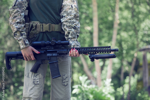 machine gun Ar-15 in woman hands