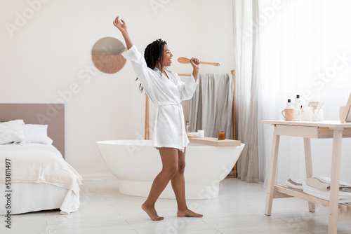 Positive African American Woman Having Fun In Bathroom, Singing With Body Brush