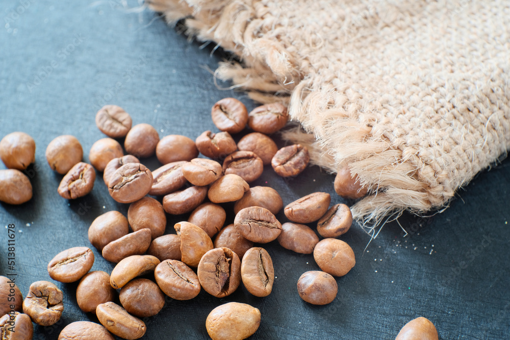 Coffee beans close-up in a canvas bag. Atmospheric beautiful photo. Concept design for a coffee shop. Coffee beans close-up in a canvas bag. Atmospheric beautiful photo. Concept design for a coffee shop.